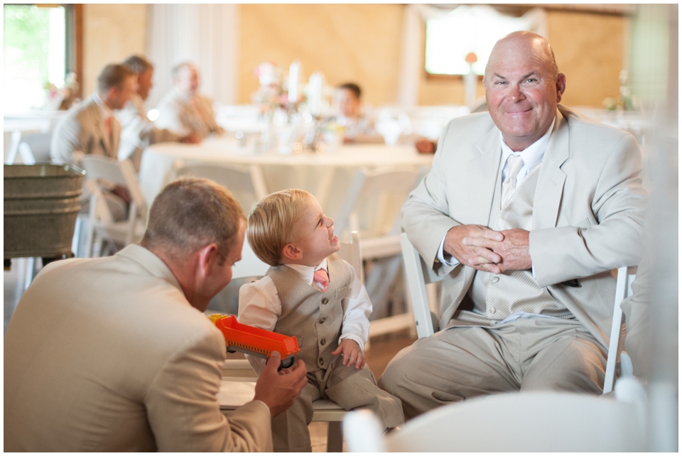 stony point hall wedding, melissa sigler photography, groom laughing with ring bearer, gray ring bearer suit