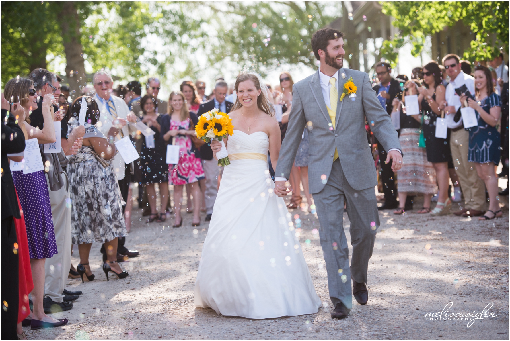 Bride and Groom bubble exit at Victorian Veranda by Lawrence Kansas wedding photographer Melissa Sigler