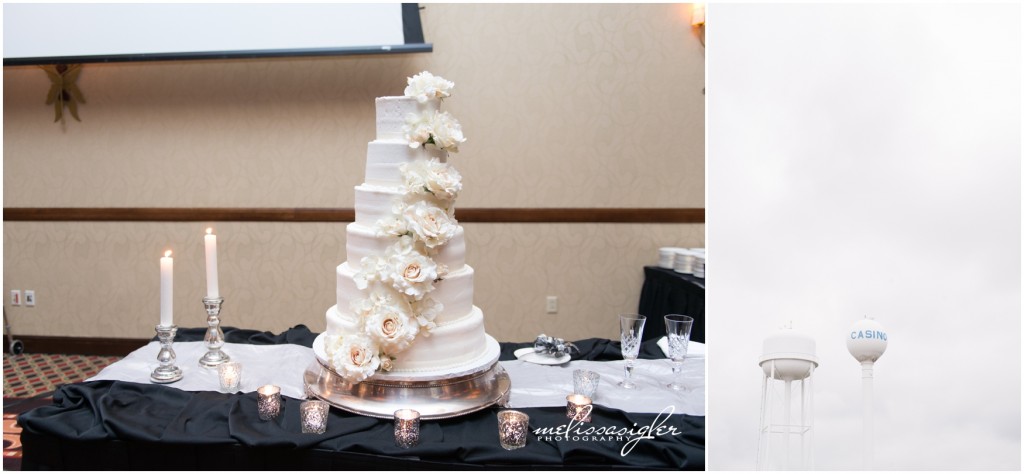 Six tiered white wedding cake at Prairie Band Casino by Topeka wedding photographer Melissa Sigler
