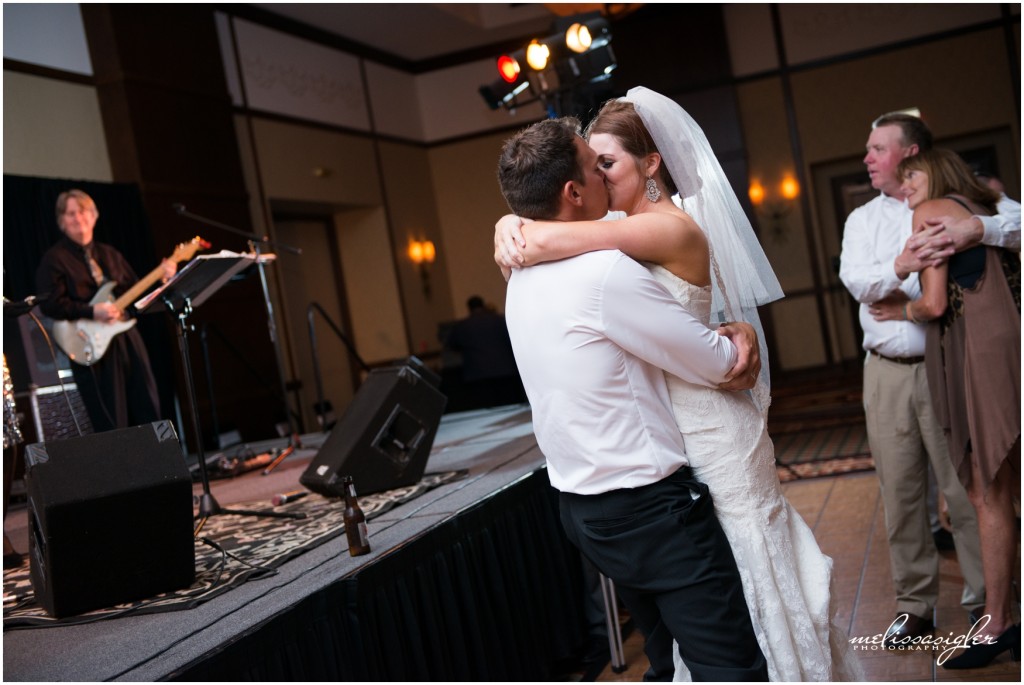 Bride and groom kiss on the dance floor at Prairie Band Casino by Topeka wedding photographer Melissa Sigler