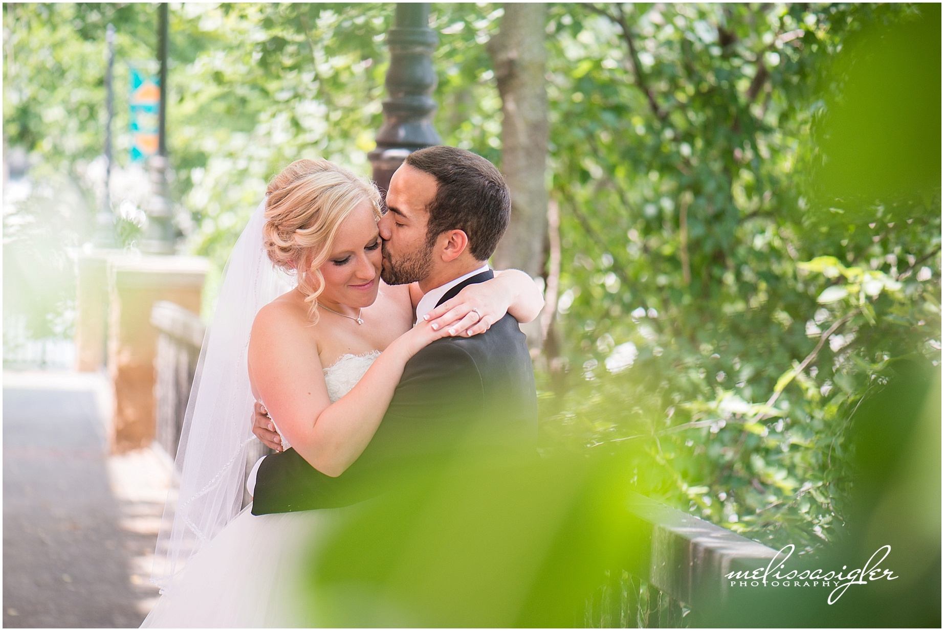 Bride and groom in Lawrence kansas by wedding photographer Melissa Sigler