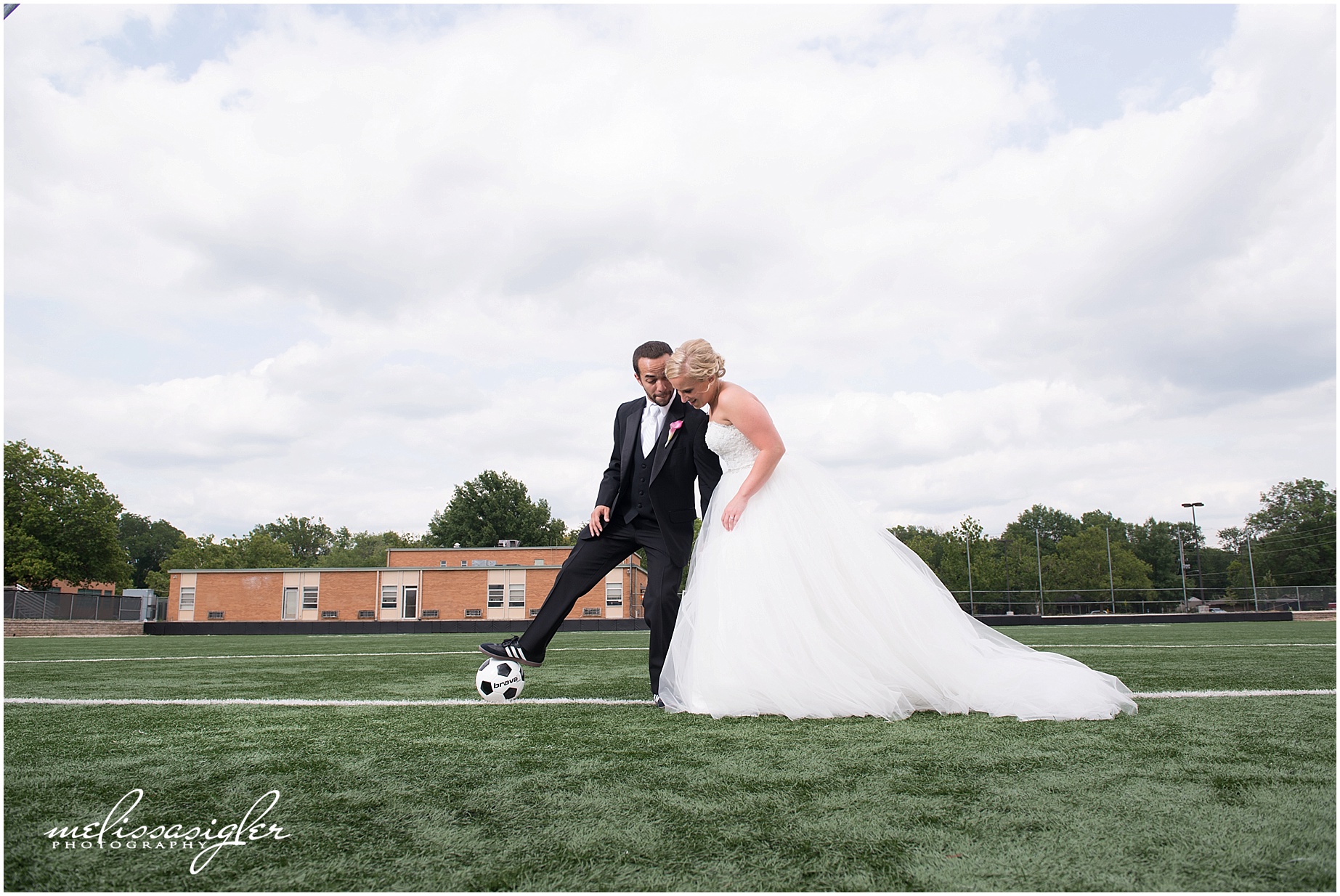 Bride and groom playing soccer in Lawrence Kansas by Melissa Sigler Photography