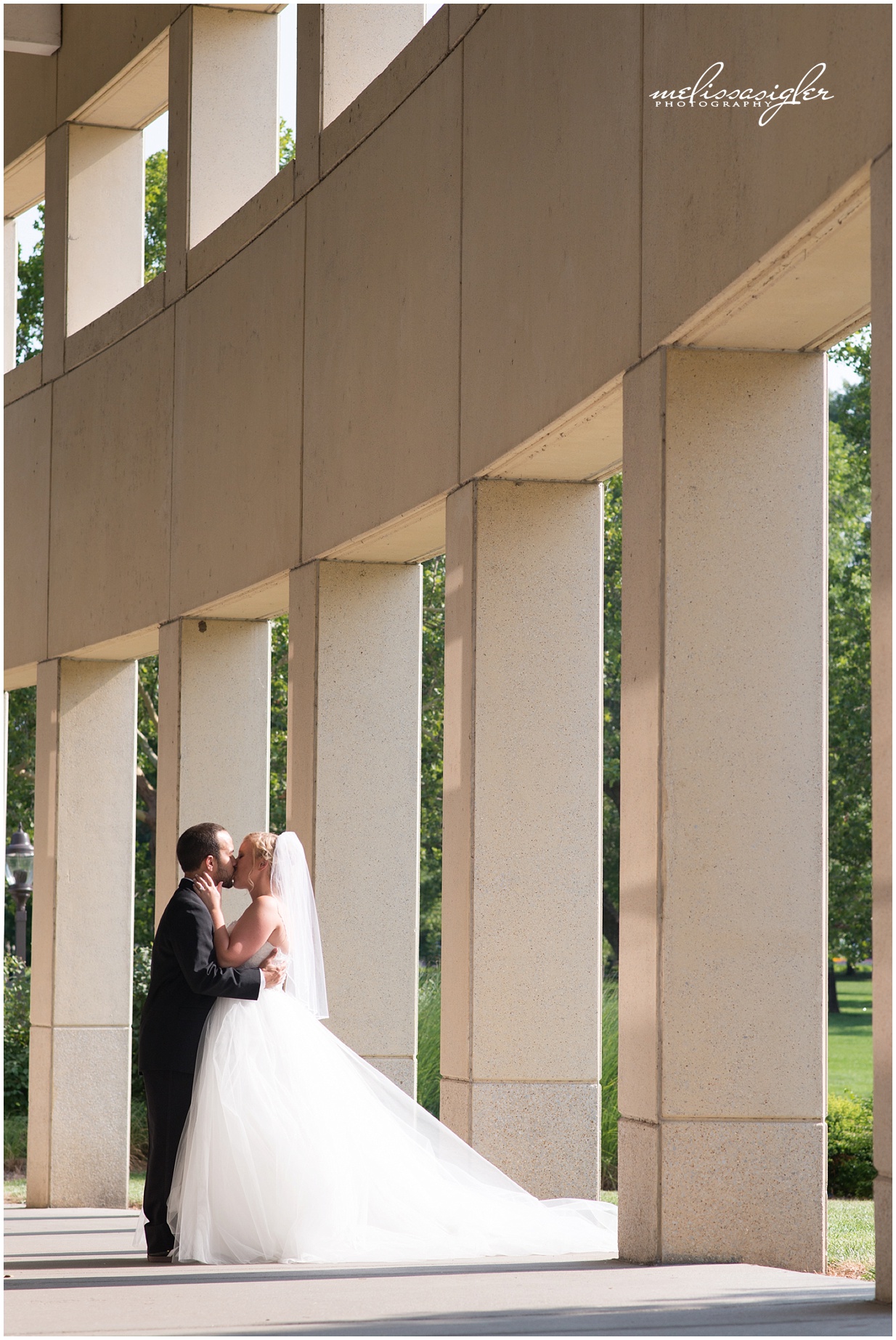 Bride and Groom portrait in downtown Lawrence by wedding photographer Melissa Sigler
