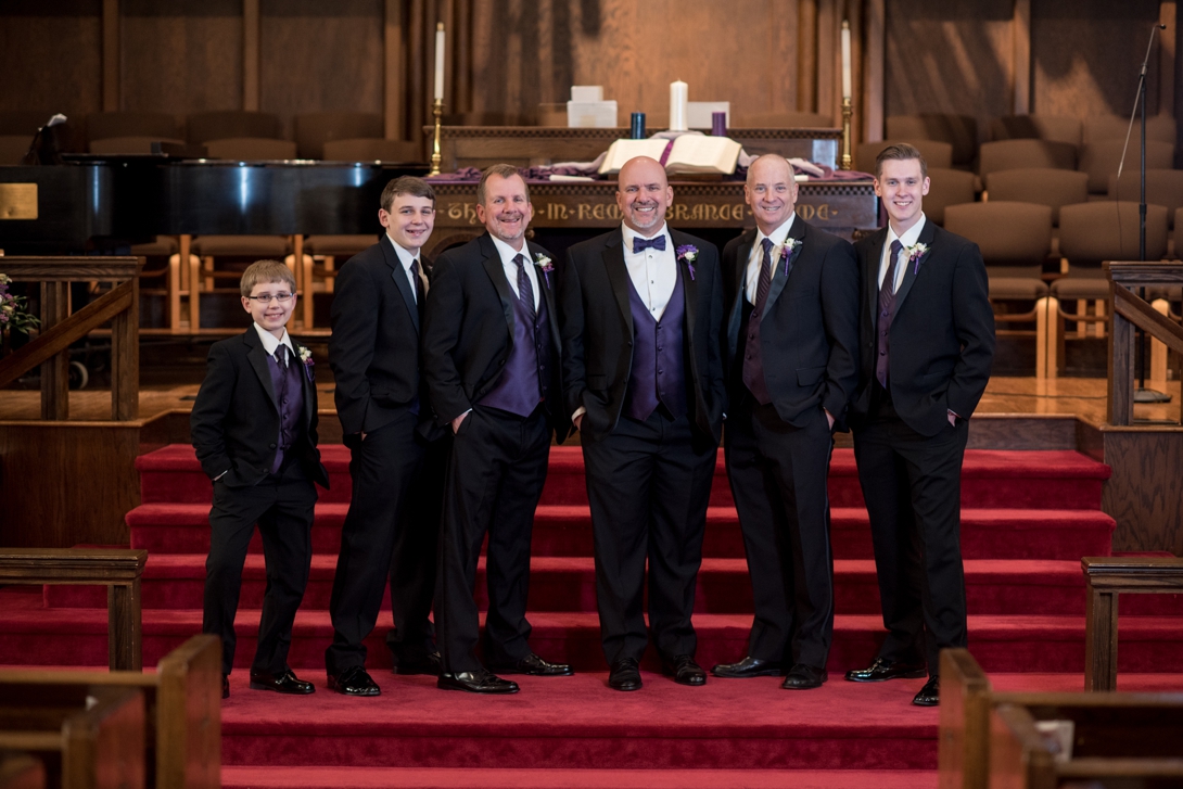 Groom and groomsmen at the altar