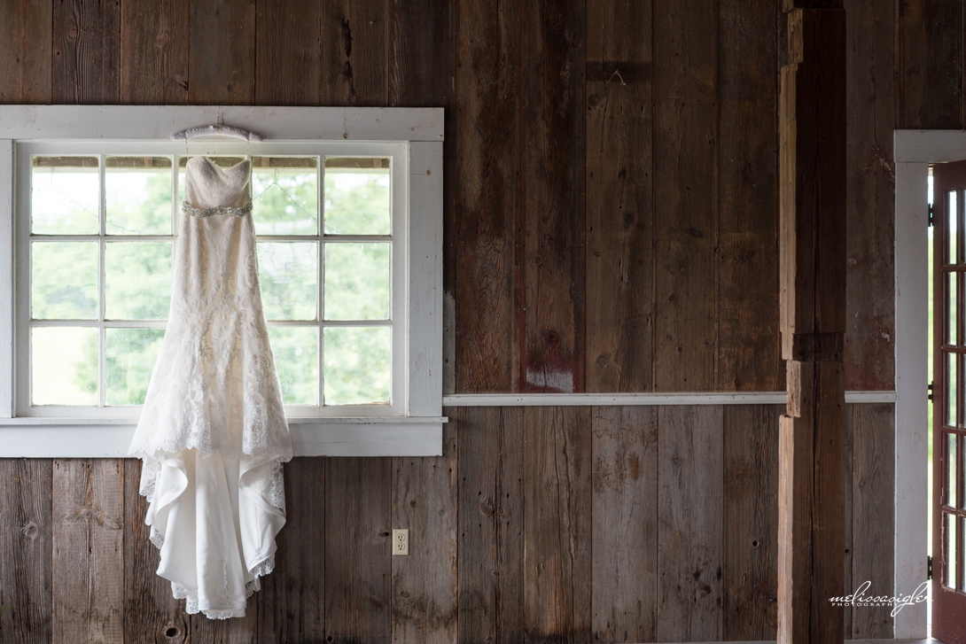 Wedding gown hanging up at Weston Red Barn Farm