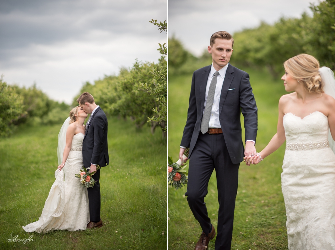 Bride and groom in apple orchard