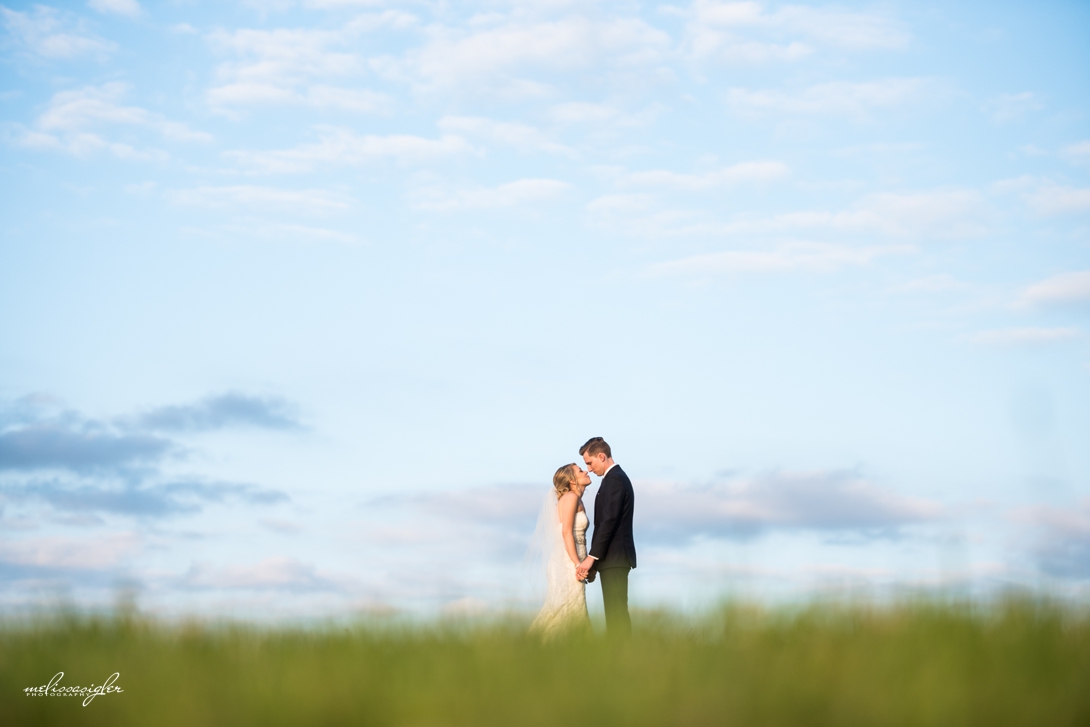Bride and groom portrait at sunset