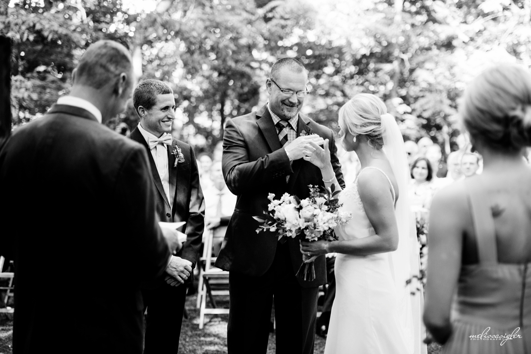 Daddy daughter secret handshake Kansas City wedding photographer