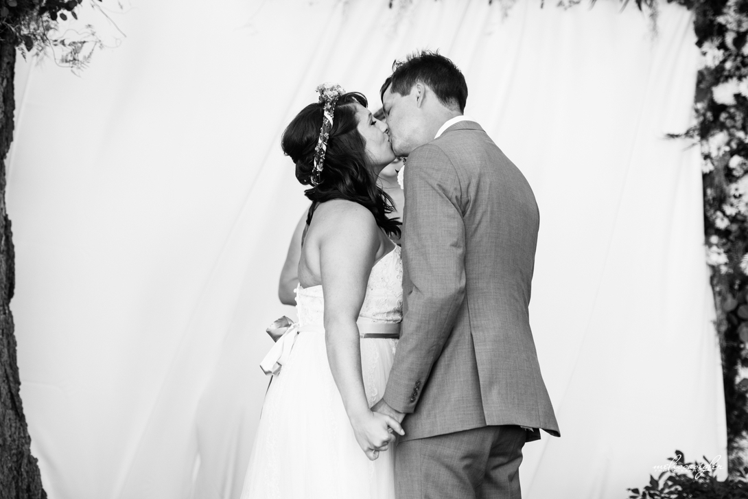 Bride and groom first kiss Manhattan Kansas
