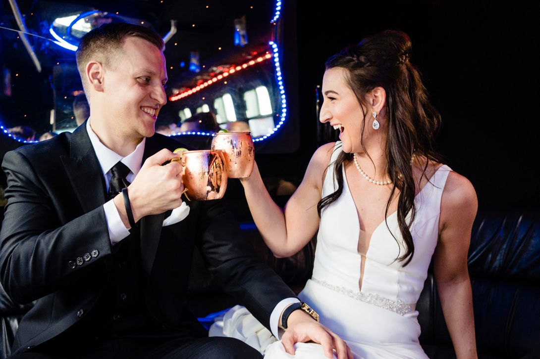 bride and groom on party bus