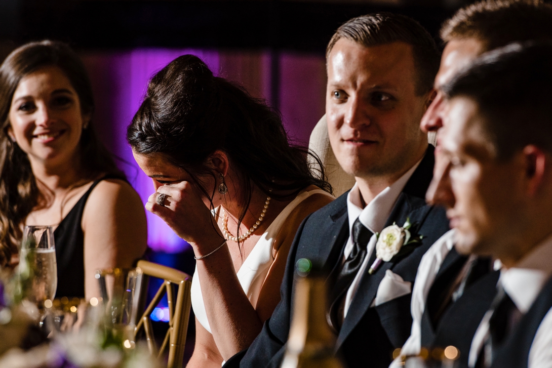 bride crying during wedding toast