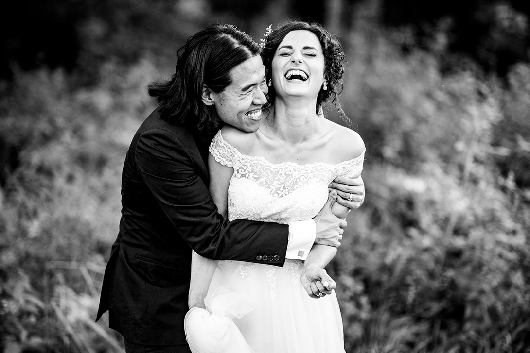 black and white portrait of newlyweds having fun
