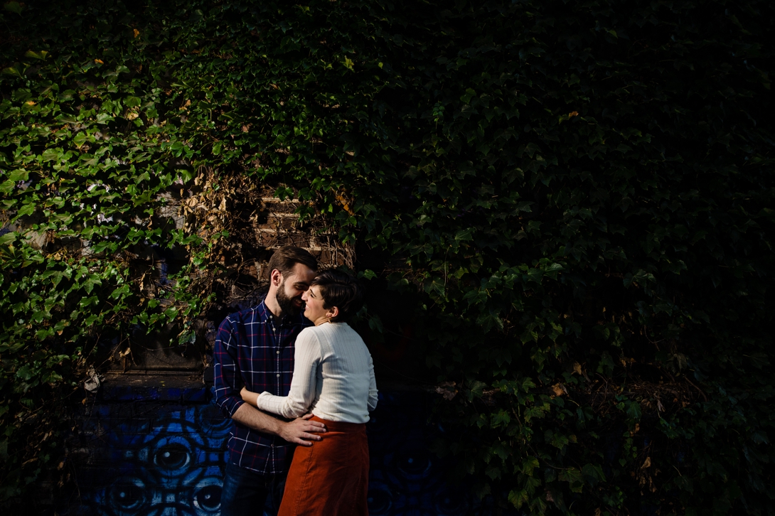 engagement photo on vine wall