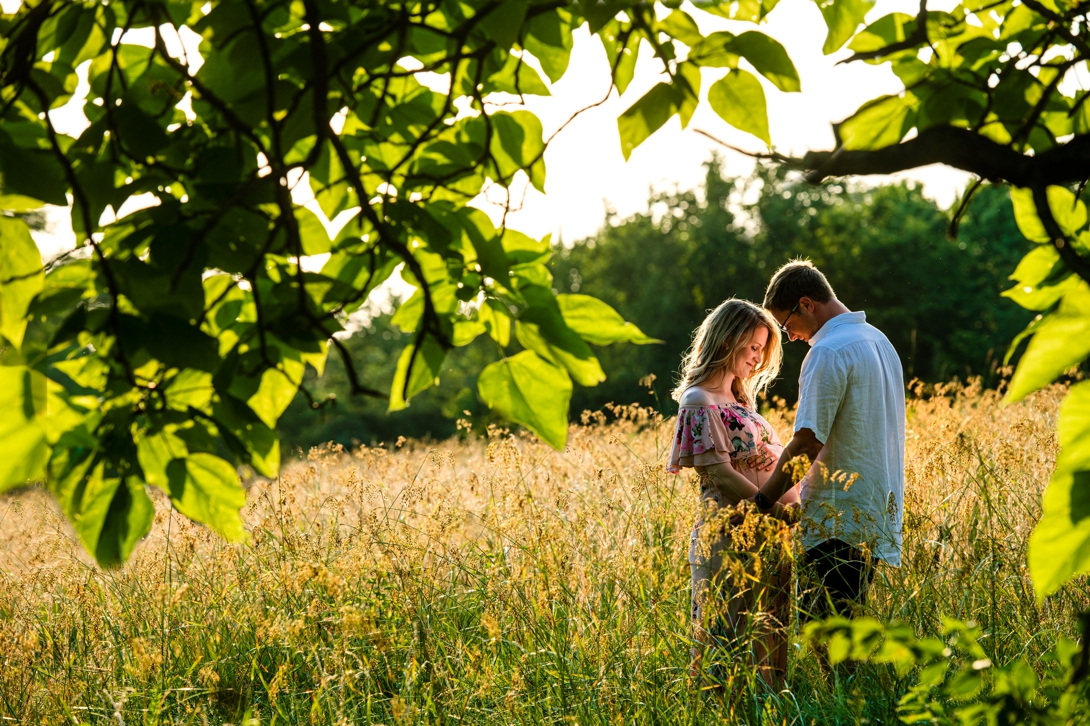 maternity photos in tall grass