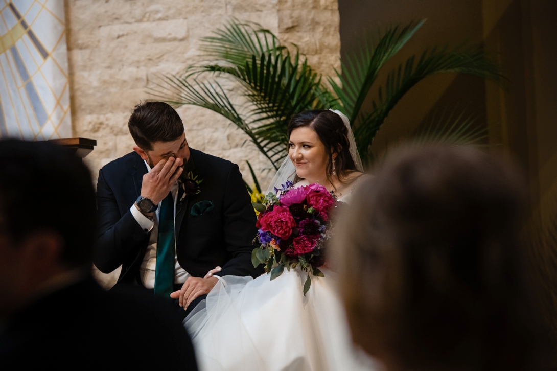 groom crying during wedding