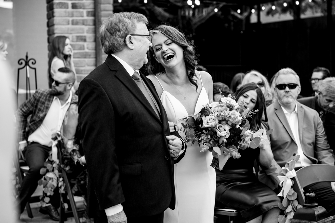 bride and father laughing